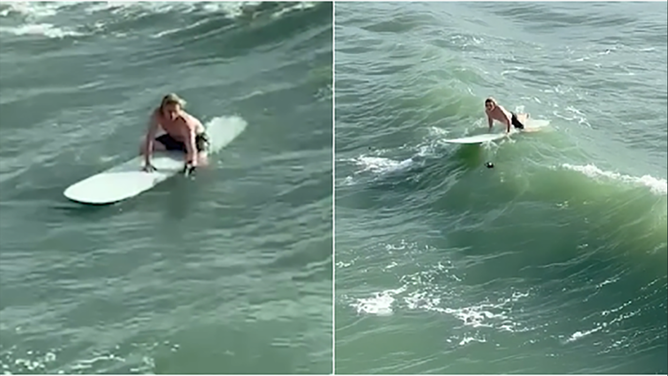 A surfer in Cocoa Beach was caught on camera in an act of kindness for a struggling bird.