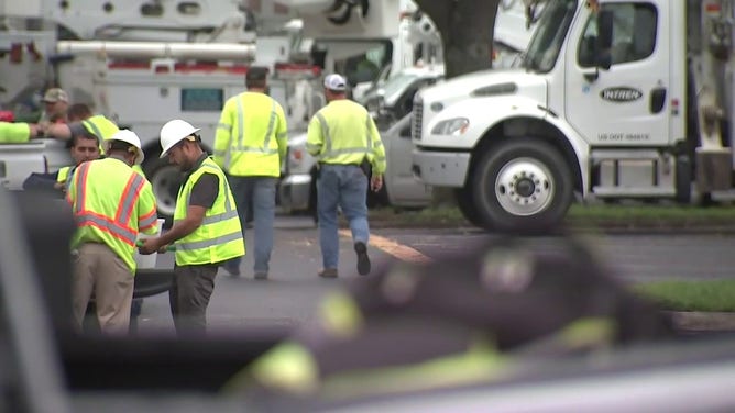 This photo shows utility workers in Florida preparing for Helene's construction.