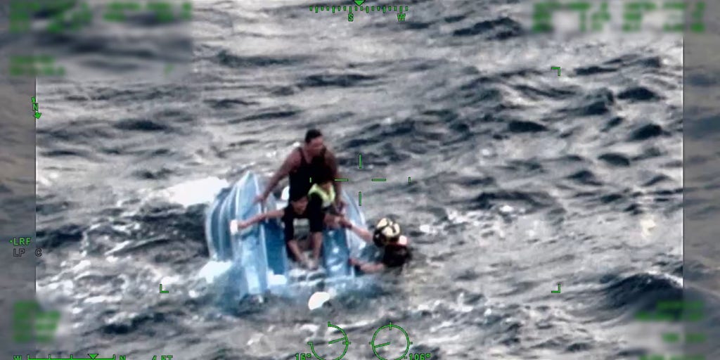 VIDEO US Coast Guard saves father and sons clinging to capsized boat