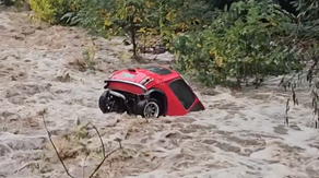 Watch: Mini Cooper bobs down raging river as flooding hits France