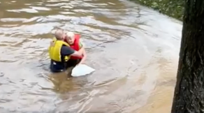 Man jumps into raging North Carolina river to save woman as home swept away by Helene