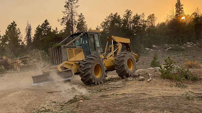 Crews continue working to extinguish the Elk Fire inside Wyoming's Bighorn National Forest.