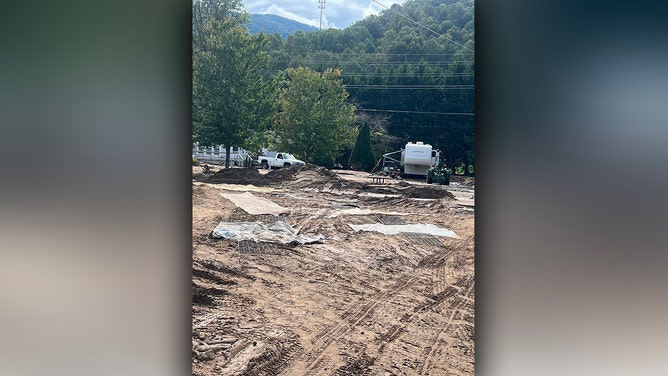 Sheryl Pfeiffer found herself fighting for her life when Hurricane Helene's floodwaters began to rise around her camper in western North Carolina. Stranded at a campground in Asheville, she and her dog, Carley, faced an uncertain future.