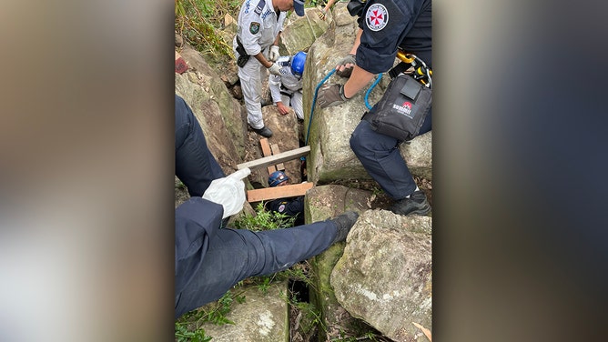 A woman was rescued after being wedged between two boulders in a nightmare seven-hour ordeal in Australia’s Hunter Valley, the New South Wales ambulance service said.