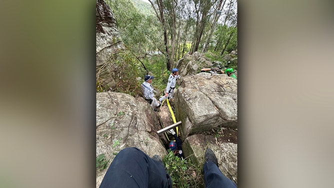 A woman was rescued after being wedged between two boulders in a nightmare seven-hour ordeal in Australia’s Hunter Valley, the New South Wales ambulance service said.