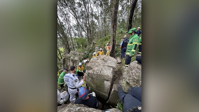 A woman was rescued after being wedged between two boulders in a nightmare seven-hour ordeal in Australia’s Hunter Valley, the New South Wales ambulance service said.