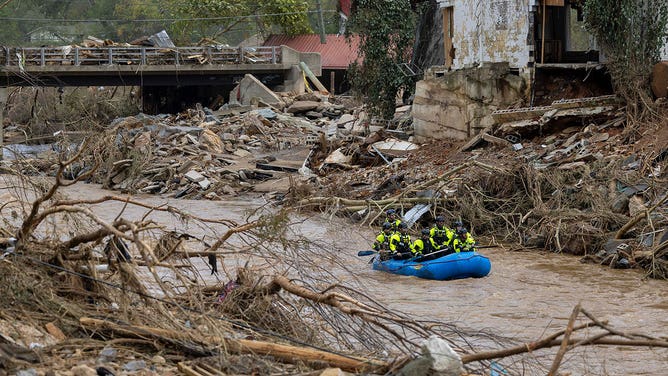 A rescue team paddles down the Swannanoa River on Sunday, Sept. 29, 2024.