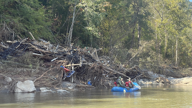 A Helene flooding rescue by the volunteer Walnut Fire Department swift water rescue team and French Broad Adventures.