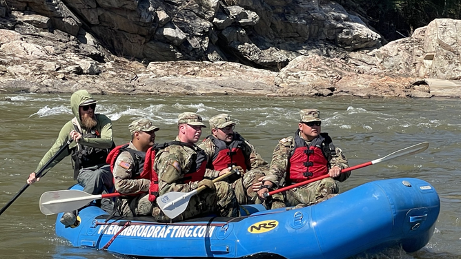 Jim Hampton (back of the raft) part of the Volunteer Walnut Fire Department Swift Water Rescue team after Hurricane Helene.