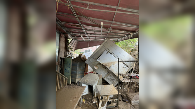 Damage caused by Hurricane Helene's flooding in western North Carolina is seen at the Corner Kitchen restaurant in Asheville, North Carolina.