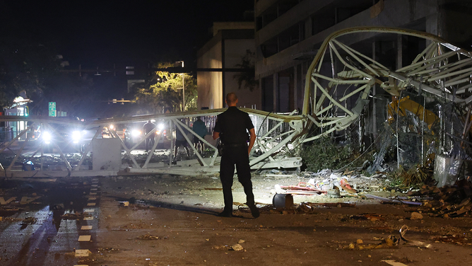 A crane sits on the street after crashing down into the building housing the Tampa Bay Times offices after the arrival of Hurricane Milton on October 10, 2024 in St. Petersburg, Florida. Milton, which comes just after the recent catastrophic Hurricane Helene, landed into Florida's Gulf Coast late Wednesday evening as a Category 3 storm causing extensive flooding and damage.