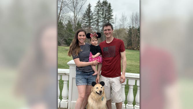 Olivia Chasse and her husband pose with their daughter, Charlotte, and their dog Ben. 