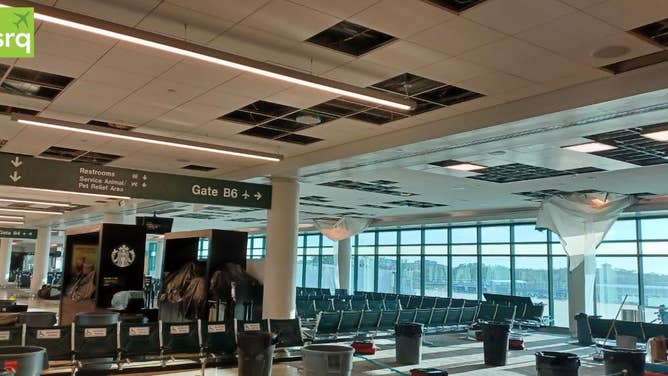Photo shows damage and repairs to the roof in Concourse B at Sarasota-Bradenton International Airport.