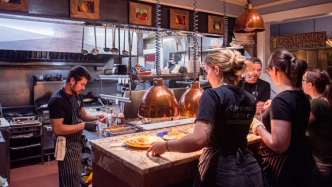 The Corner Kitchen restaurant in Asheville, North Carolina is seen in front of the damage caused by Hurricane Helene's flooding in western North Carolina.