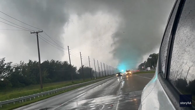 Broken power lines flashed as a tornado quickly spun across a road in Wellington, Florida, on Wednesday, October 9, amid Hurricane Milton’s approach.