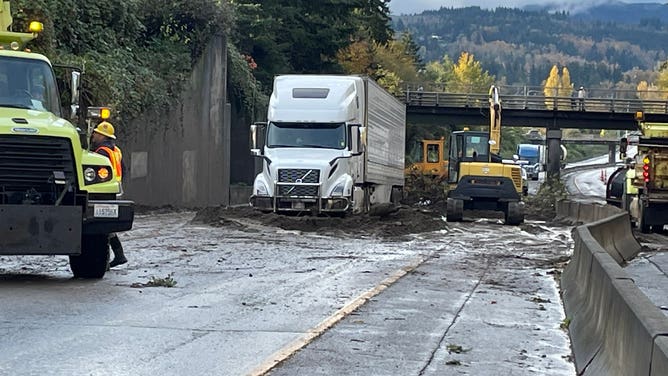 A semi-truck stuck in the debris from a landslide on I-5 near Bellingham, Washington on Oct. 27, 2024.
