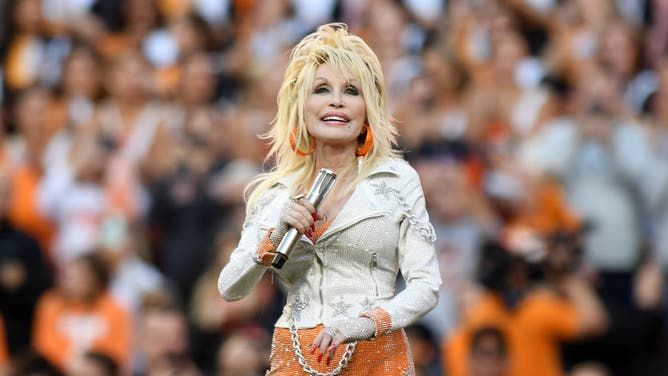 Dolly Parton performs during the college football game between the Georgia Bulldogs and the Tennessee Volunteers on November 18, 2023, at Neyland Stadium in Knoxville, TN.