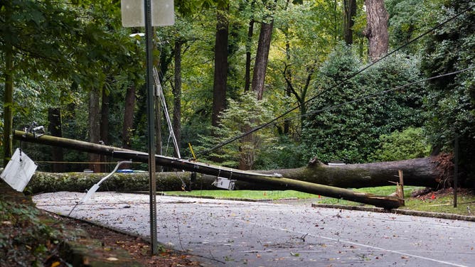 ATLANTA, GEORGIA - SEPTEMBER 27: A tree and power line lay across a road in Buckhead after hurricane Helene brought in heavy rains overnight on September 27, 2024 in Atlanta, Georgia. Hurricane Helene made landfall late Thursday night as a category 4 hurricane in the panhandle of Florida and is working its way north, it is now considered a tropical storm. (Photo by Megan Varner/Getty Images)