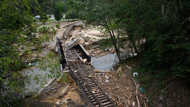 Destroyed train tracks are seen from a Main Street bridge in the aftermath of Hurricane Helene on September 30, 2024 in Old Fort, North Carolina.