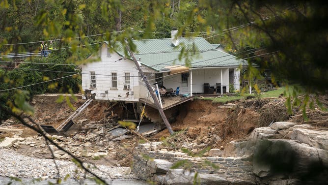 BAT CAVE, NORTH CAROLINA - OCTOBER 1: A house along the Broad River in the aftermath of Hurricane Helene on October 1, 2024 in Bat Cave, North Carolina. The death toll has topped 140 people across the southeastern U.S. due to the storm, according to published reports, which made landfall as a category 4 storm on Thursday. Millions are without power and the federal government has declared major disasters in areas of North Carolina, Florida, South Carolina, Tennessee, Georgia, Virginia and Alabama, freeing up federal emergency management money and resources for those states, according to the reports. (Photo by Sean Rayford/Getty Images)