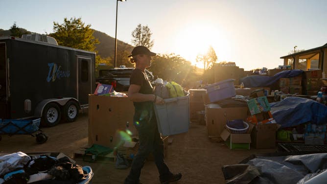 A volunteer with Savage Freedoms Relief Operation puts together supplies to deliver to remote communities in Swannanoa, North Carolina, on October 7, 2024 after the passage of Hurricane Helene. 