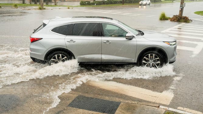 A vehicle at an intersection beginning to flood ahead of Hurricane Milton's expected landfall in St. Petersburg, Florida, US, on Wednesday, Oct. 9, 2024. Hurricane Milton churned toward Florida's west coast with winds powerful enough to demolish houses, threatening to unleash once-in-a-century flooding across some of the state's fastest-growing counties. Photographer: Tristan Wheelock/Bloomberg via Getty Images