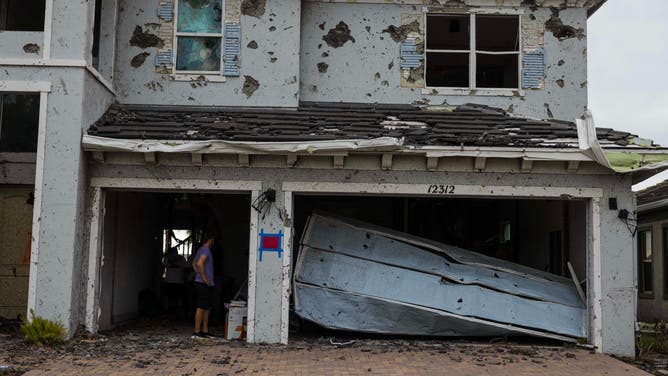A damaged home is seen on October 10, 2024 in Palm Beach Gardens, Florida