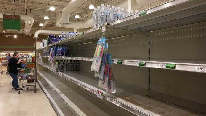 Shelves at a grocery store are empty of bottled water as Hurricane Milton churns in the Gulf of Mexico on October 07, 2024 in St. Petersburg, Florida.