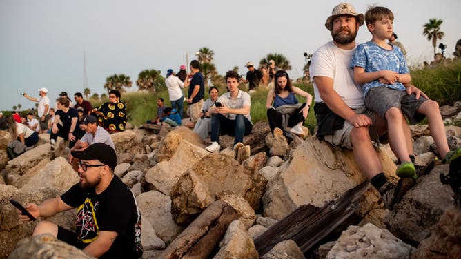 People await the launch of the SpaceX Starship from Starbase near Boca Chica, Texas, on October 13, 2024, for the Starship Flight 5 test. SpaceX successfully "caught" the first-stage booster of its Starship megarocket Sunday as it returned to the launch pad after a test flight, a world first in the company's quest for rapid reusability.