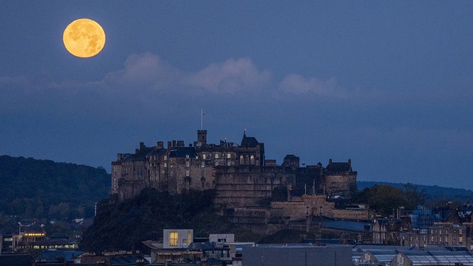 October's full moon, known as Hunter's, sets behind Edinburgh Castle on Thursday, October 17, 2024. (Photo by via Getty Images)