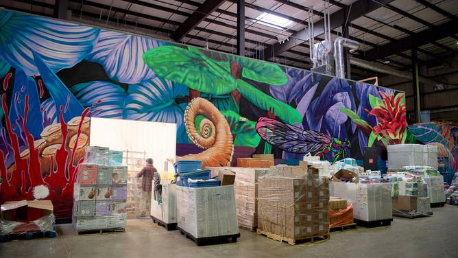 Donated water, food, and supplies stored in a warehouse at Highland Brewing in Asheville, North Carolina October 15, 2024.