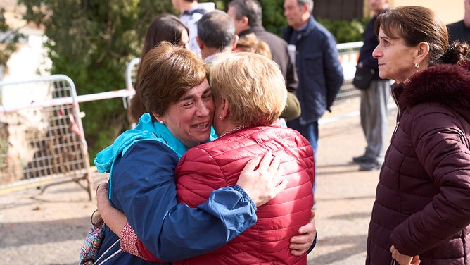 Residents rejoice in the morning after heavy rains and flash floods hit the area on October 30, 2024 in Letur, Albacete province, Spain.