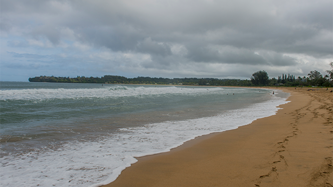 FILE - UNITED STATES - 2021/12/08: Dark rain clouds over Hanalei beach on the northern end of the Hawaiian Island of Kauai, Hawaii, USA. (Photo by Wolfgang Kaehler/LightRocket via Getty Images)