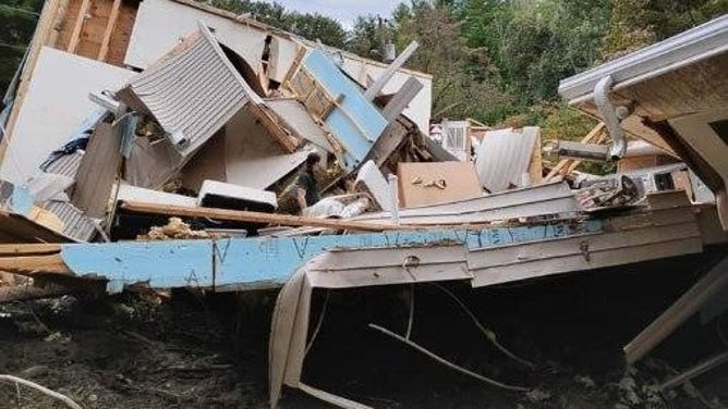 The destruction left behind of Donna and Michael Johns' home after a mudslide caused by Hurricane Helene. 