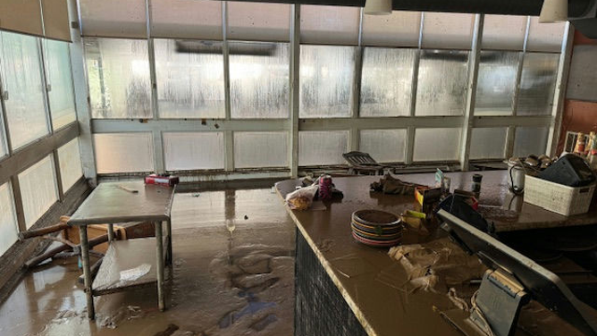 Damage caused by Hurricane Helene's flooding in western North Carolina is seen at the Corner Kitchen restaurant in Asheville, North Carolina.