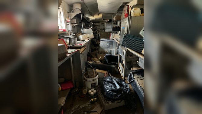 Damage caused by Hurricane Helene's flooding in western North Carolina is seen at the Corner Kitchen restaurant in Asheville, North Carolina.