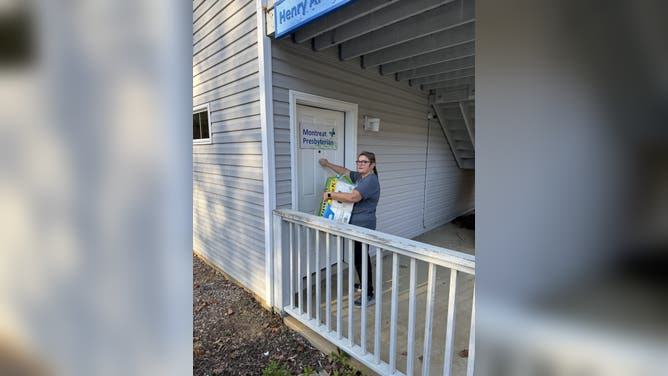 Cindy Riley delivers supplies to someone after Hurricane Helene