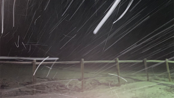 This photo shows snow falling in the Smoky Mountains on the Tennessee-North Carolina border.