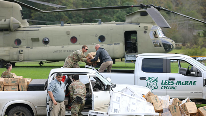Soldiers assigned to the Connecticut, Maryland and North Carolina National Guard work together to distribute food and water to local first responders in Avery County on Sept 29, 2024. National Guard Aviation crews from Connecticut, Maryland, Pennsylvania and Iowa are supporting the NC Emergency Management and the NCNG in response to citizens affected by Helene. (U.S. Army National Guard photo by Sgt. 1st Class Leticia Samuels)
