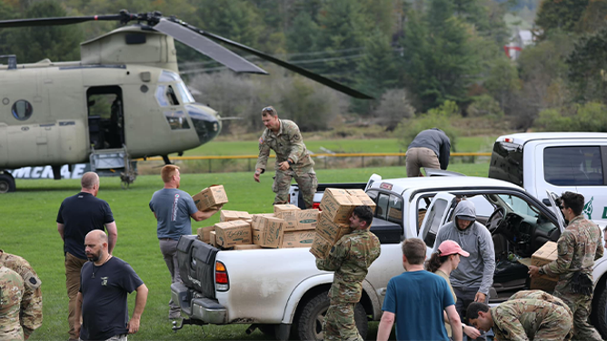 Soldiers assigned to the Connecticut, Maryland and North Carolina National Guard work together to distribute food and water to local first responders in Avery County on Sept 29, 2024. National Guard Aviation crews from Connecticut, Maryland, Pennsylvania and Iowa are supporting the NC Emergency Management and the NCNG in response to citizens affected by Helene. (U.S. Army National Guard photo by Sgt. 1st Class Leticia Samuels)