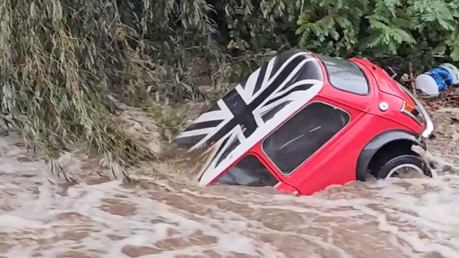 The Mini Cooper in the flood.