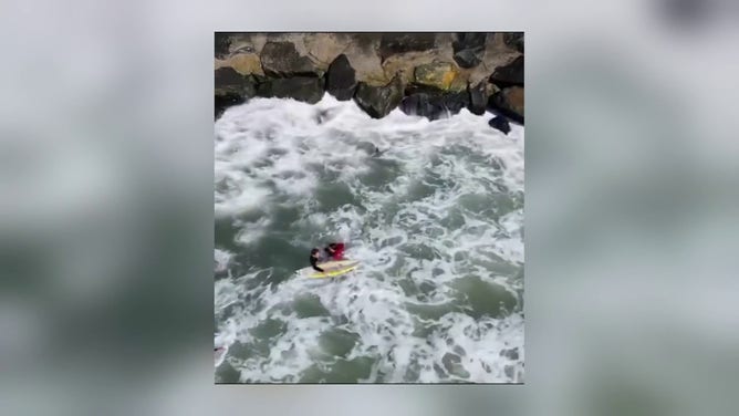 Surfer rescues man from rough waters after he fell off a jetty in New Jersey