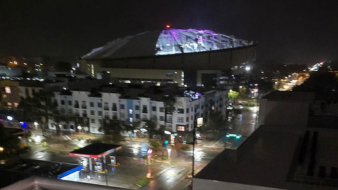 Hurricane-force winds rip the roof off Tropicana Field.