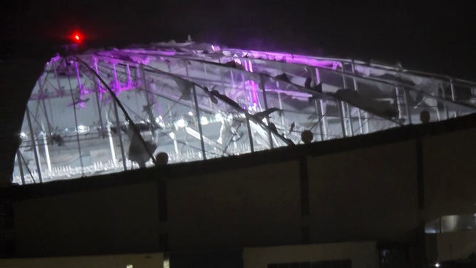 Hurricane-force winds rip the roof off Tropicana Field.