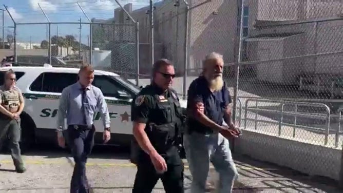 This image shows John Burgos being walked into the Brevard County Jail on Wednesday, Oct. 23, 2024.