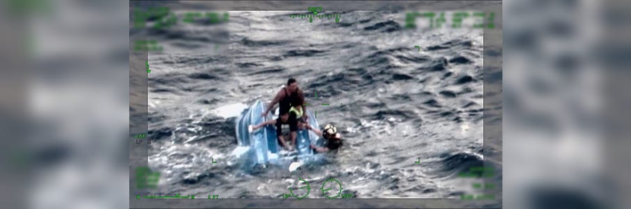 Watch: US Coast Guard saves father and sons clinging to capsized boat in Hawaii