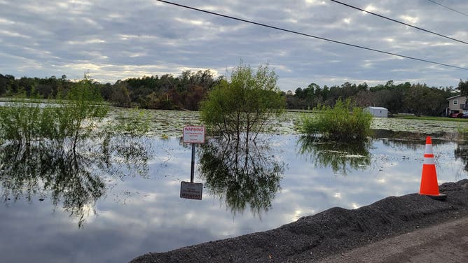 A flooded retention pond that is still flooded in Orange City, Florida, more than six weeks after Hurricane Milton.