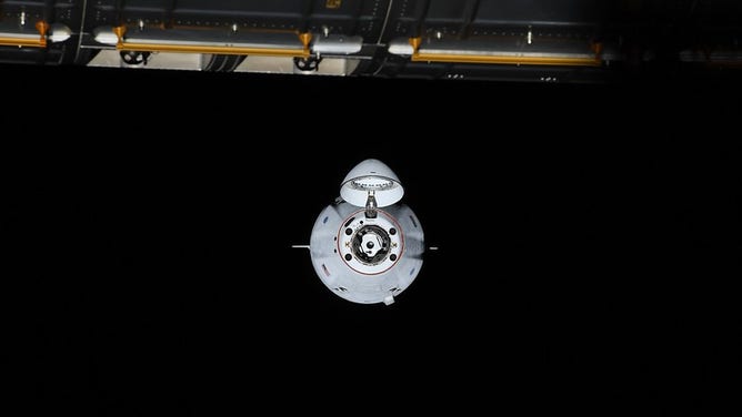 SpaceX's Cargo Dragon approaches the International Space Station for docking in 2021. 