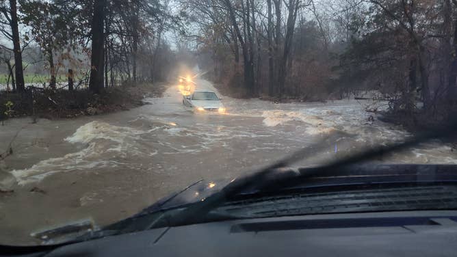 Vehicle drives through high tide in St. Francois County, Missouri.