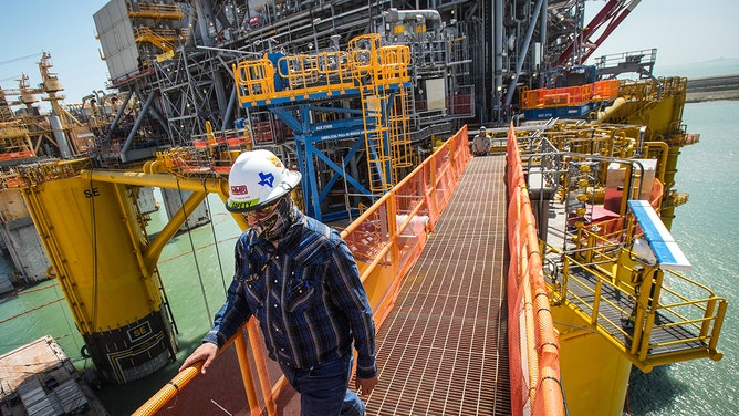 A worker walks across the gangplank as he leaves Shellís Vito platform as workers continue construction on the project at the Kiewit Offshore Services complex Wednesday, April 6, 2022 in Ingleside.